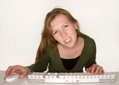 Confused Woman Viewing Computer Monitor