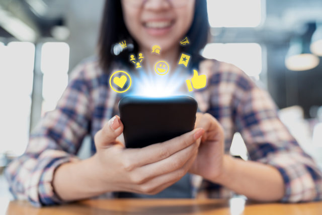 Close Up Smartphone Social Media Network Sharing And Commenting