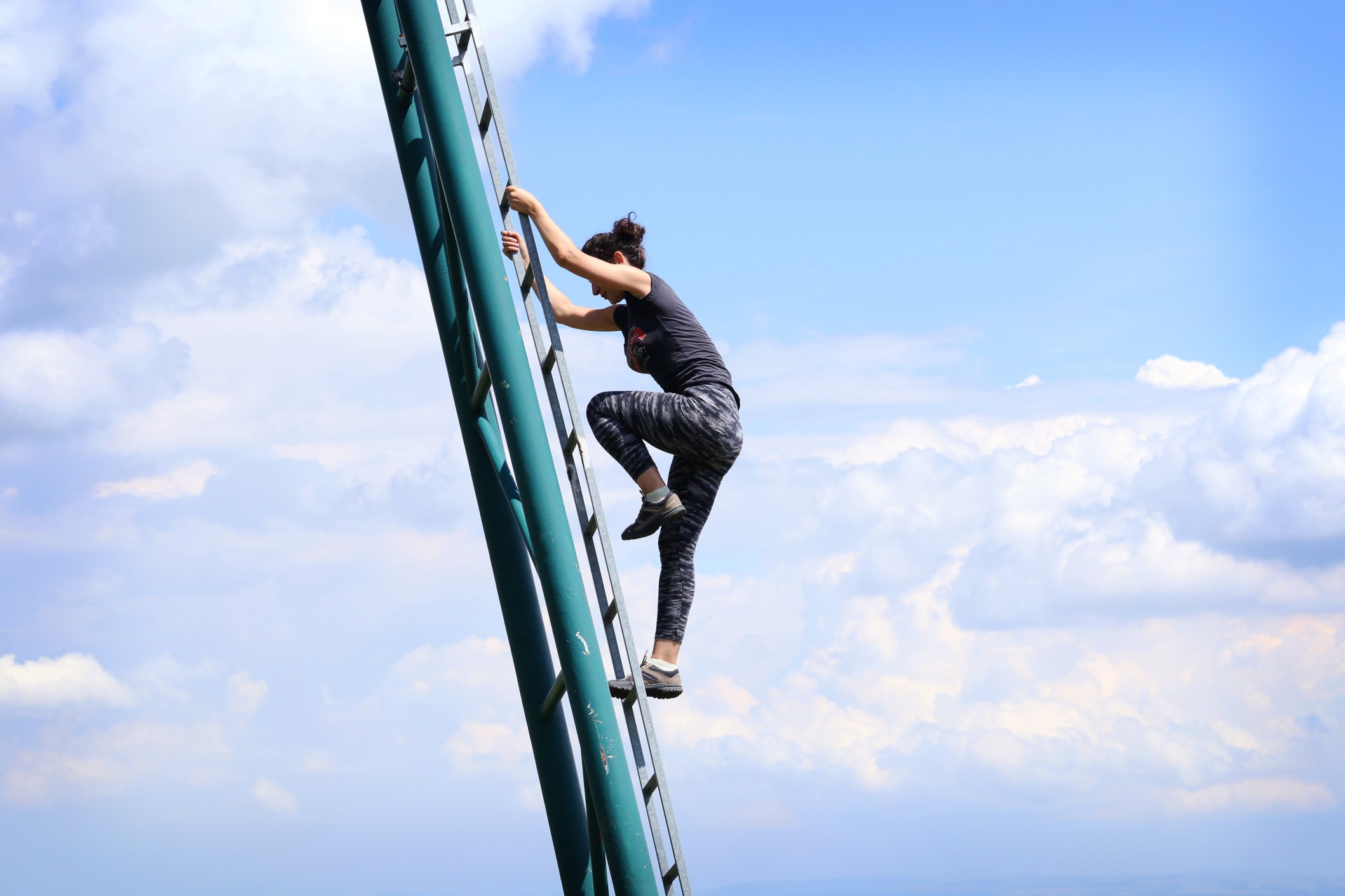 woman climbing a ladder