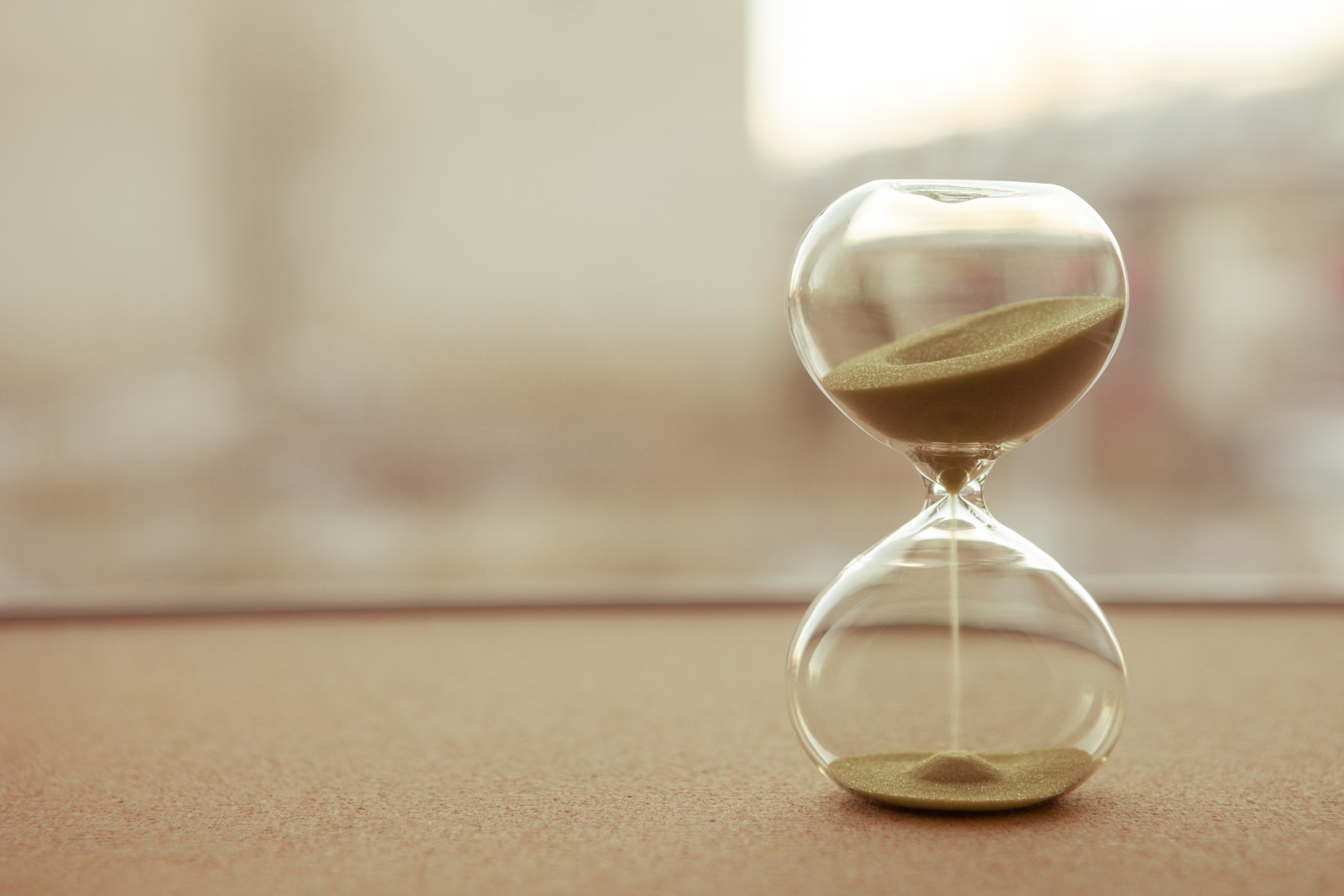 sand running through an hour glass