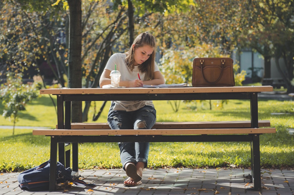 Woman working at a picnic table