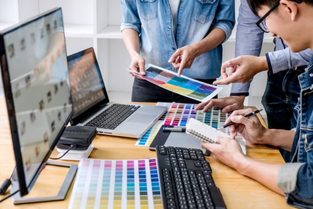 young-creative-team-having-a-meeting-in-creative-office-architectural-drawing-with-work-tools-and_t20_vRjw7E graphic design